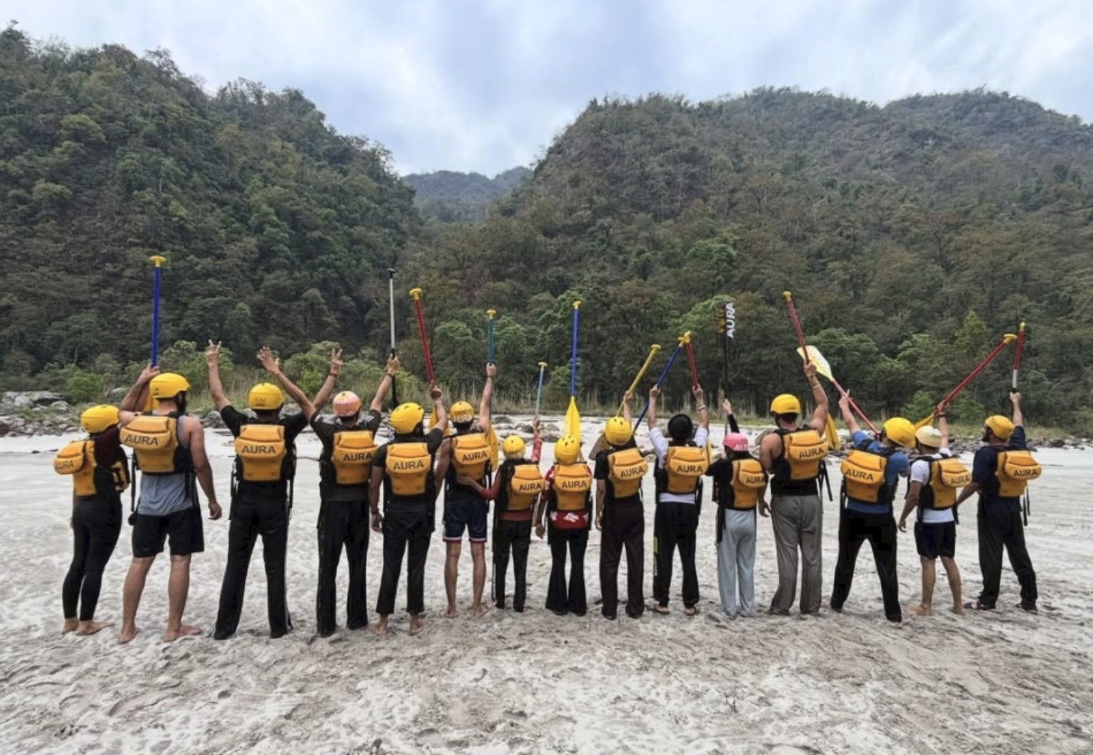 Travel group posing together outdoors